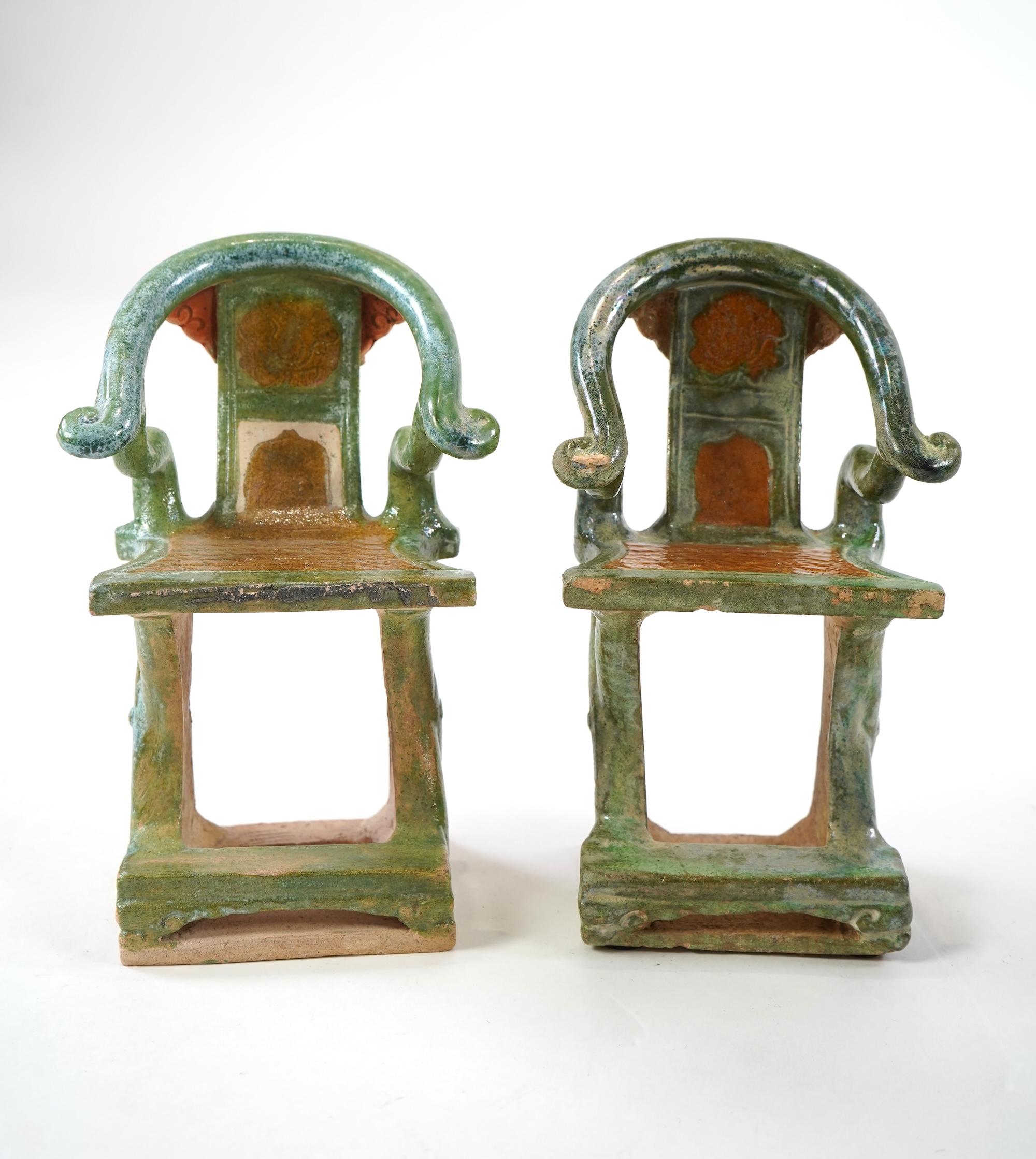 A set of Chinese Ming Sancai models of table with offerings and a pair of horseshoe shaped armchairs, 16th century